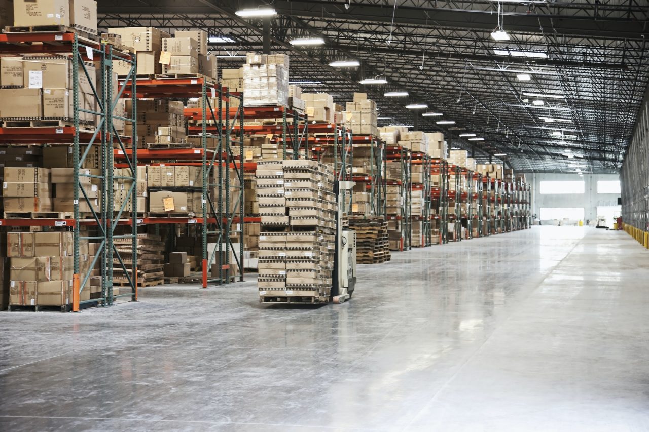 cardboard boxes on shelves in warehouse